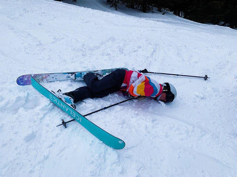 Hannah on the ground after falling while skiing.
